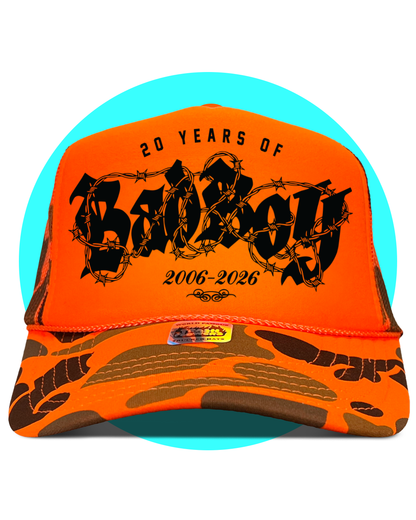 20 Years of Bad Boy Joey Janela Camo Trucker Hat