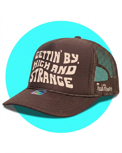 Gettin By Gettin High and Strange Trucker Hat